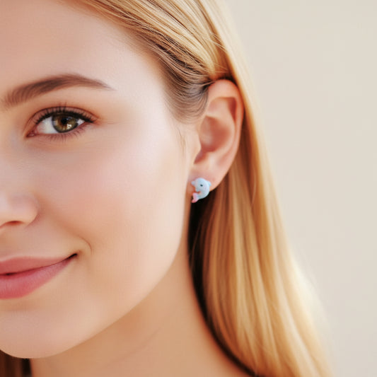 dolphin earrings in an ear model