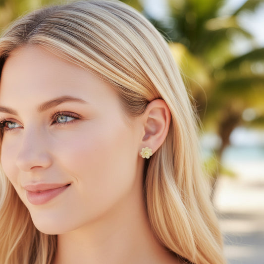 yellow smiley face flower earrings on model