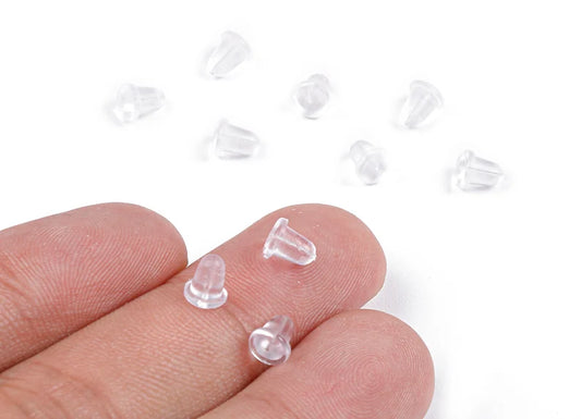rubber earring backs on fingers