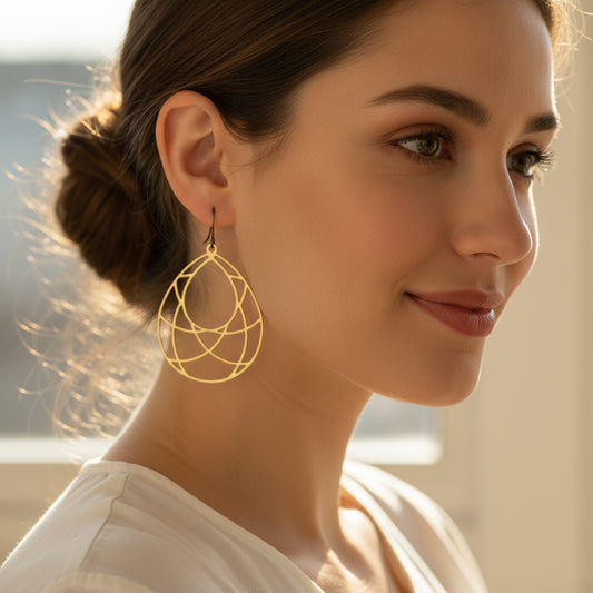 open teardrop dangle earrings with geometric design