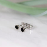 Titanium stud earrings, bezel set crystals, black