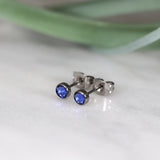 Titanium stud earrings, bezel set crystals, deep blue