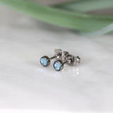 Titanium stud earrings, bezel set crystals, aqua blue