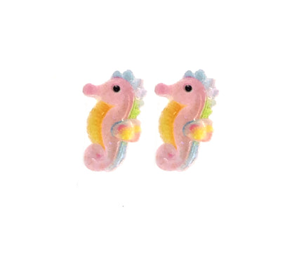 A pair of seahorse-shaped stud earrings in multicolor design, crafted from resin, displayed against a white background.