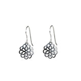 A pair of silver flower dangle earrings with a polished finish, attached to the ear via a plastic hook.