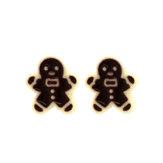 A pair of gingerbread man-shaped stud earrings in a two-tone color scheme, with a white background.