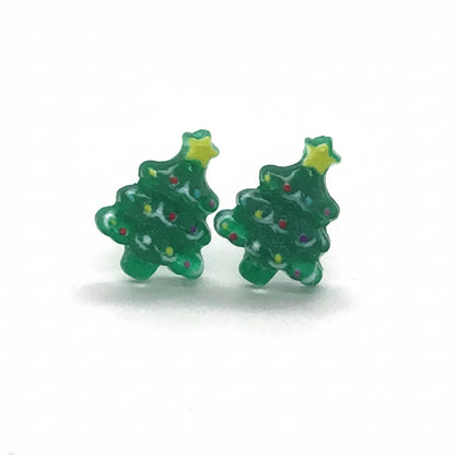 A pair of green Christmas tree-shaped stud earrings with a star detail on top, displayed against a white background.
