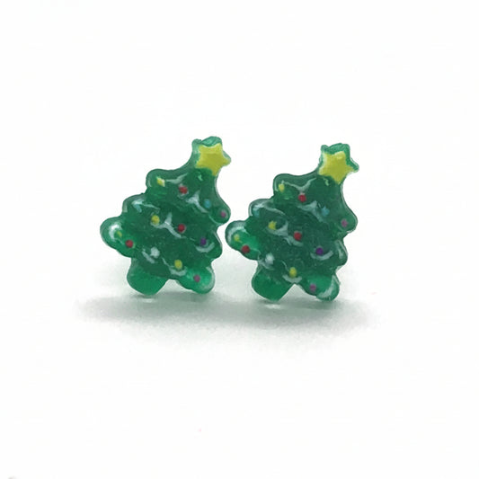 A pair of green Christmas tree-shaped stud earrings with a star detail on top, displayed against a white background.