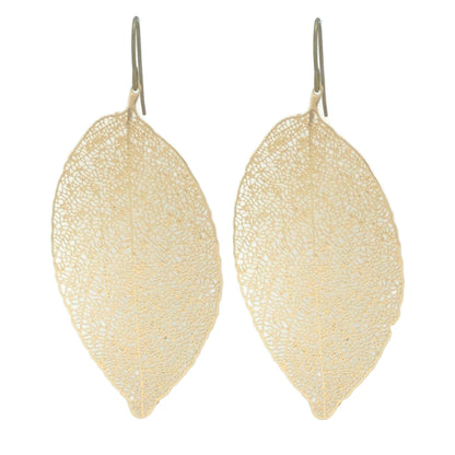 A pair of gold-colored leaf-shaped dangle earrings.