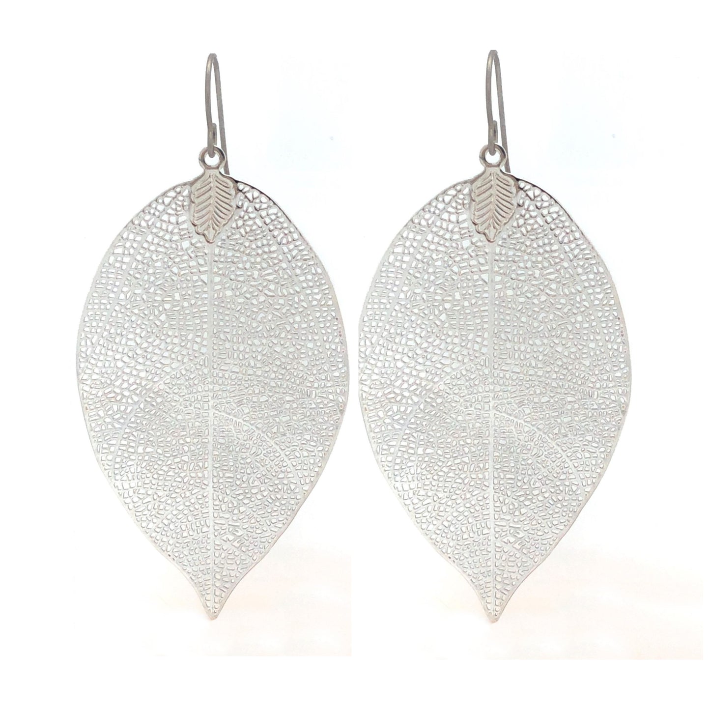 A pair of silver-colored leaf-shaped dangle earrings with a textured design.