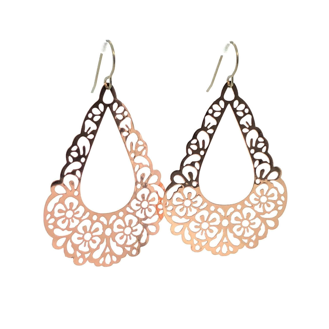 A pair of pink floral filigree teardrop dangle earrings.