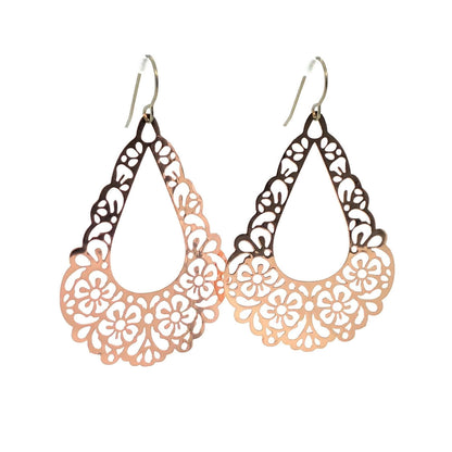 A pair of pink floral filigree teardrop dangle earrings.