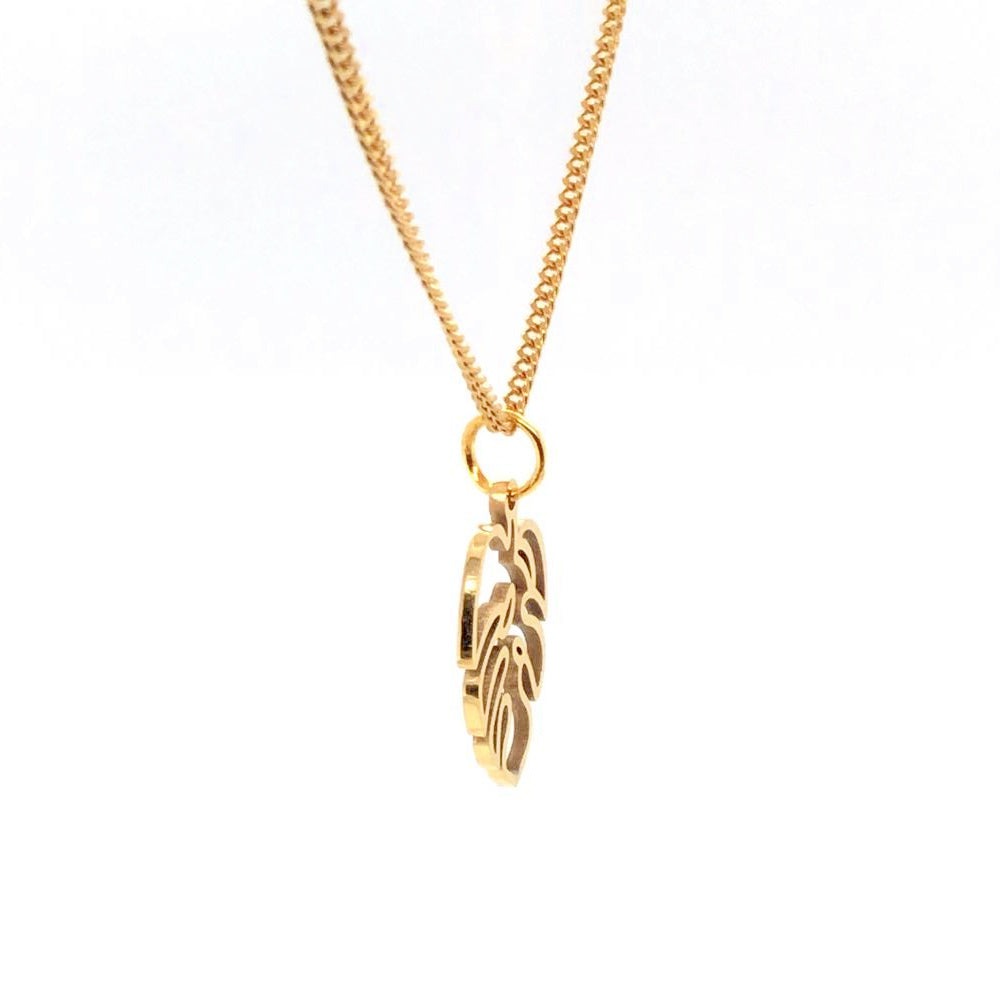 gold monstera charm on curb chain