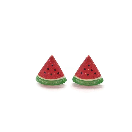 A pair of watermelon slice-shaped stud earrings in red and green colors, made of resin, displayed against a white background.