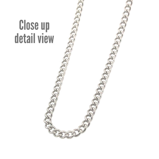 A close-up image of a 18K gold PVD plated stainless steel curb chain necklace, showcasing its texture and shine.