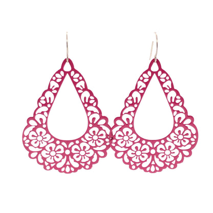 A pair of pink floral filigree teardrop dangle earrings.