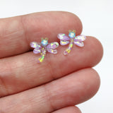 purple yellow dragonfly earring in a hand