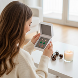 Model opening Set of Christmas-themed earrings in a box