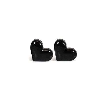 A set of heart-shaped stud earrings in various colors including black, red, pink, white, and purple, displayed in a row.