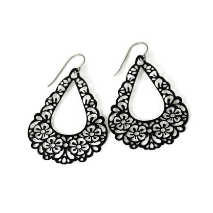 A pair of black floral filigree teardrop dangle earrings.