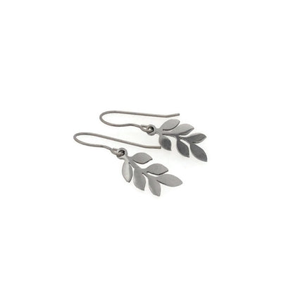 Silver leaf-shaped earrings on a white background