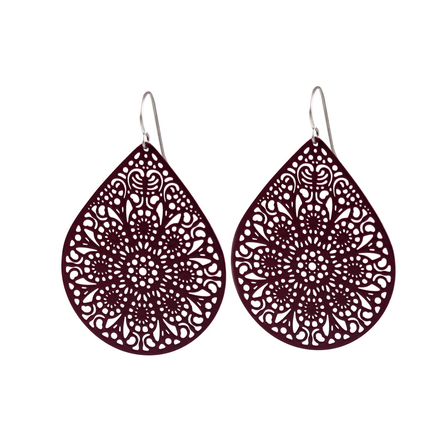 A pair of teardrop-shaped earrings with a lace filigree design in a dark color.