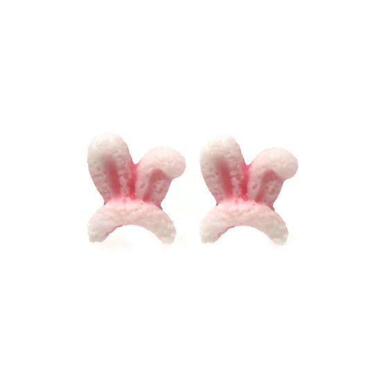 A pair of pink bunny ear stud earrings made of resin, designed to resemble simple bunny ears with a pink inner ear detail.