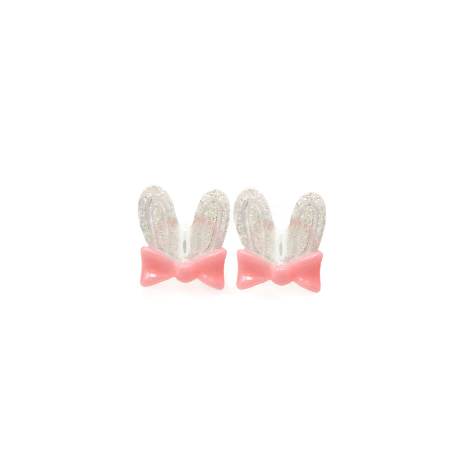 A pair of pink bunny ear bow stud earrings with clear embellishments on the ears.