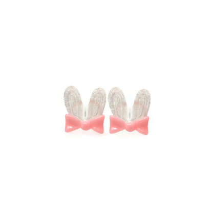 A pair of pink bunny ear bow stud earrings with clear embellishments on the ears.