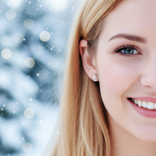 Close-up of an ear with a snowman-shaped earring.