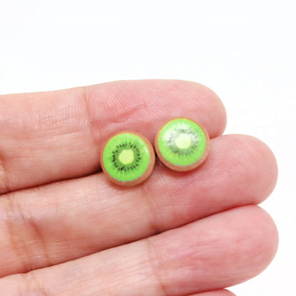 kiwi earrings in a hand