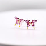 Pink Butterfly-shaped earrings on a white background