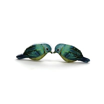 A pair of aqua blue bird stud earrings made from resin, displayed against a white background.