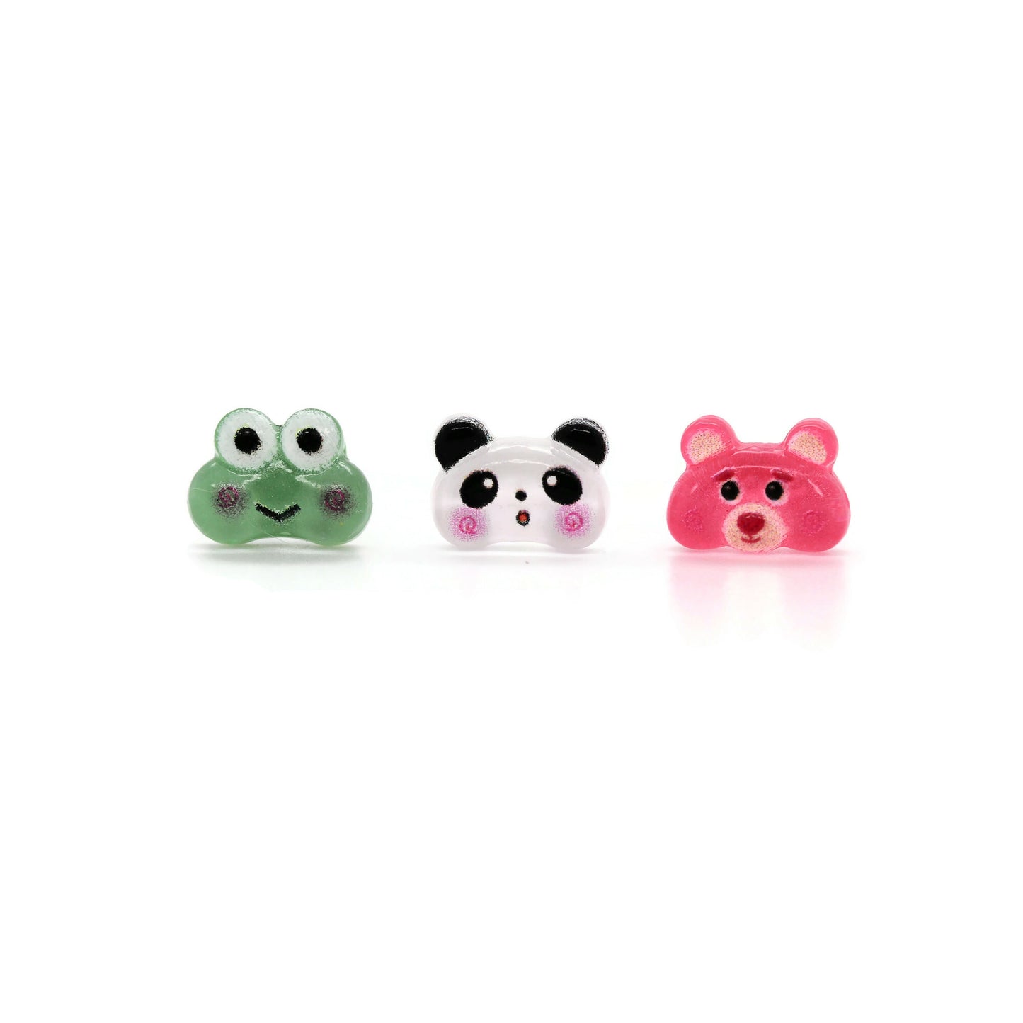 A set of three stud earrings featuring a green frog, white panda, and pink bear designed with resin material.