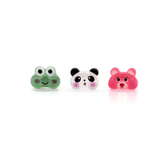 A set of three stud earrings featuring a green frog, white panda, and pink bear designed with resin material.
