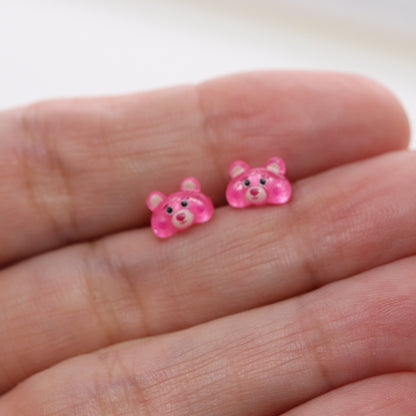 pink bear earrings in a hand