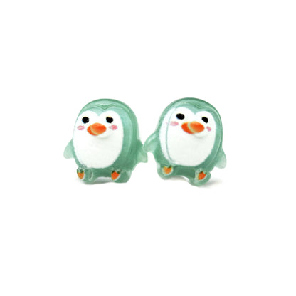Pair of penguin-shaped earrings on a white background