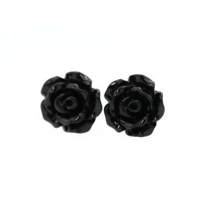 A pair of black rose flower earrings made of resin, displayed against a white background.