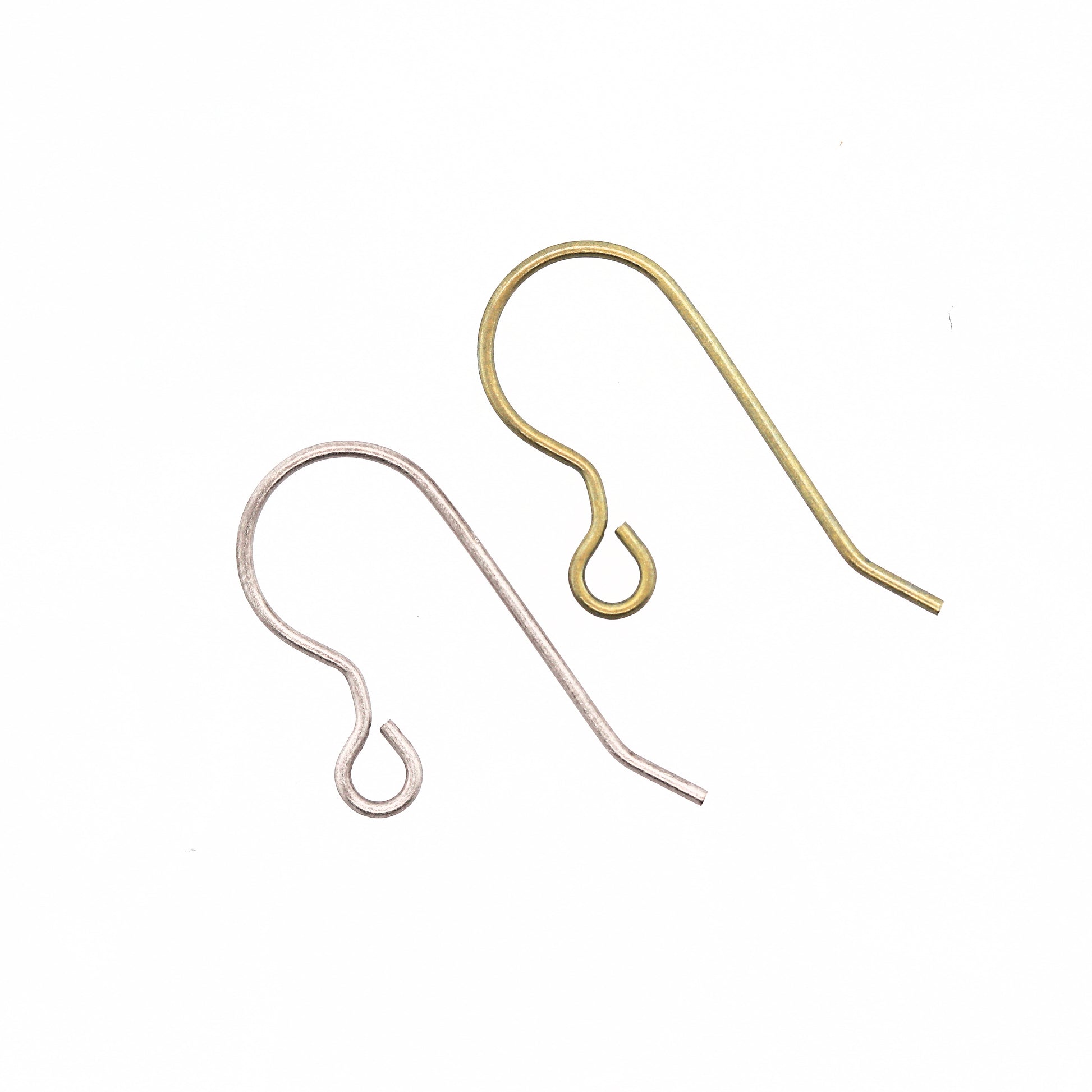A pair of pure titanium earring hooks one with a silver finish one with a gold finish, displayed against a white background.