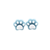 Pair of blue paw print earrings on a white background