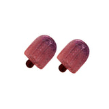 Pair of purple/pink ice pop earrings on a white background