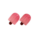 Pink glittery popsicle-shaped earrings on a white background