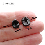 Two coffee bean earrings in a hand with measurements indicated 10mm x 8mm or 12mm x 10mm