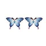 Pair of blue butterfly earrings on a white background