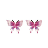 Pair of pink butterfly earrings on a white background