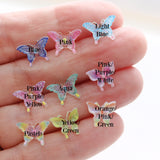 Colorful butterfly-shaped objects on a hand with labeled colors.