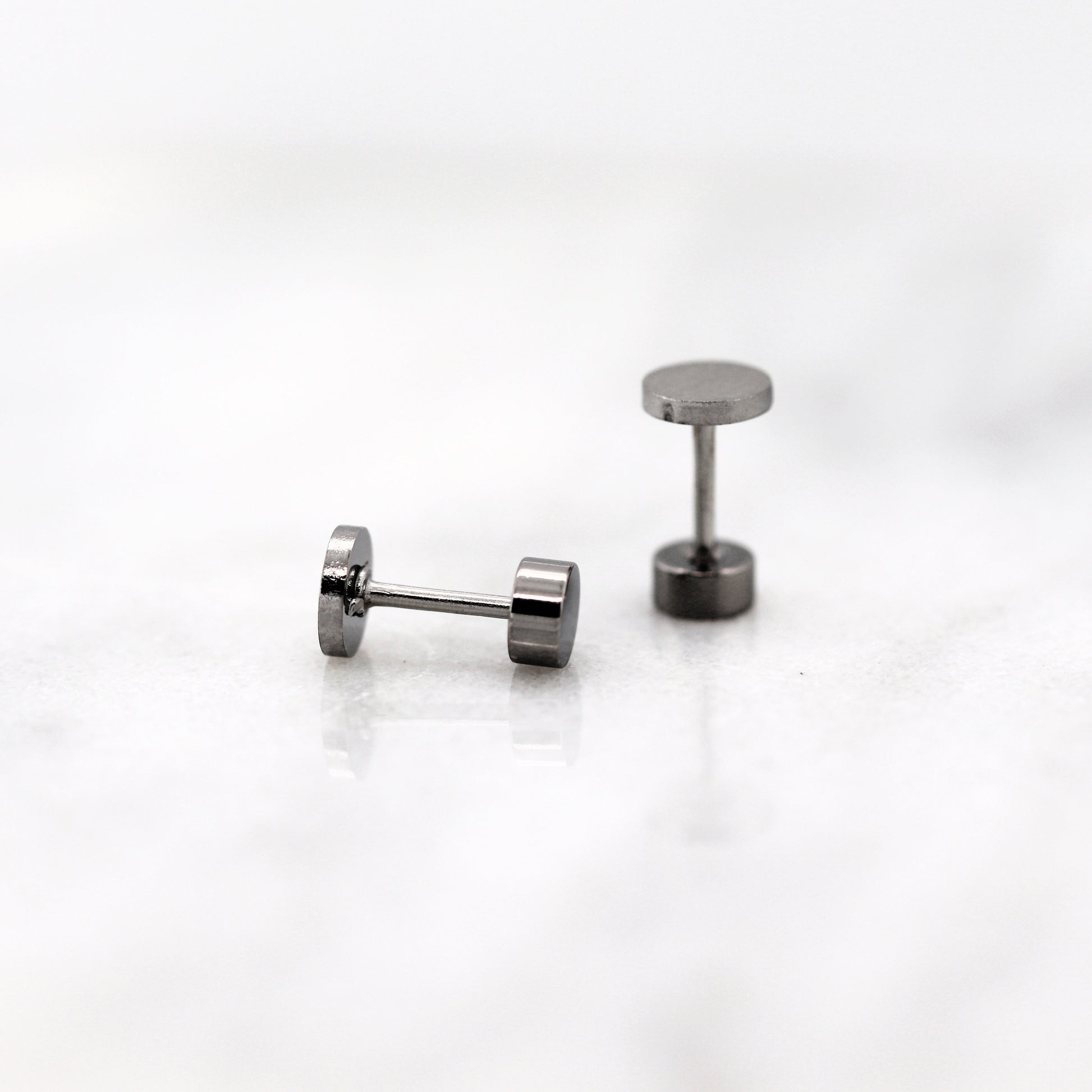 screw on back findings on a white background