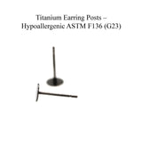 Titanium earring posts on a white background with text indicating hypoallergenic ASTM F136 (G23) certification.