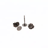Pair of titanium earring posts with backs on a white background