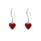 Red heart-shaped earrings on a white background